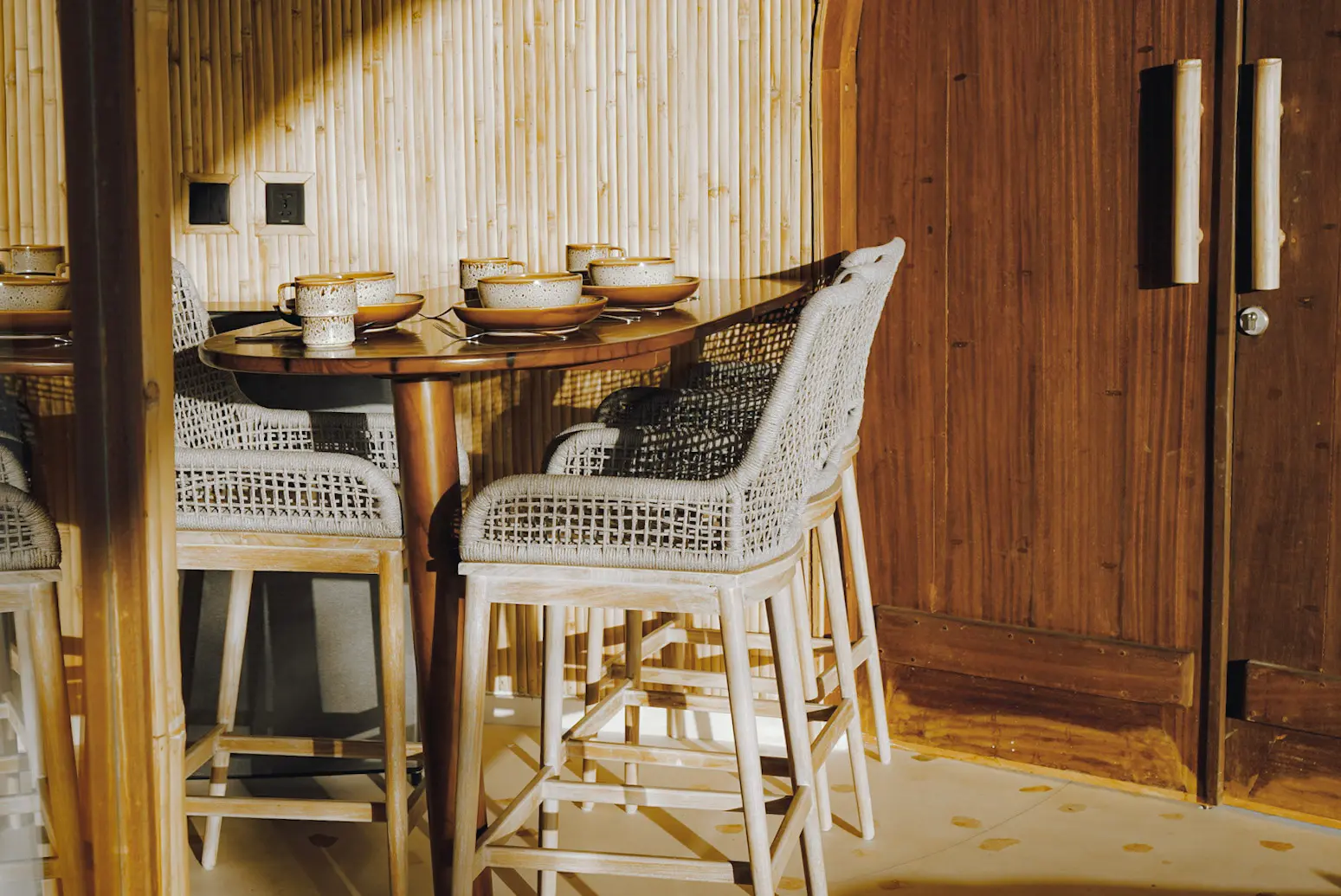 Interior of Eco Bamboo Beach Front Lodge showing curved bamboo ceiling and natural light — Kini Resort Sumbawa